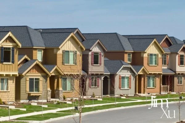 How does a townhouse differ from a rowhouse?